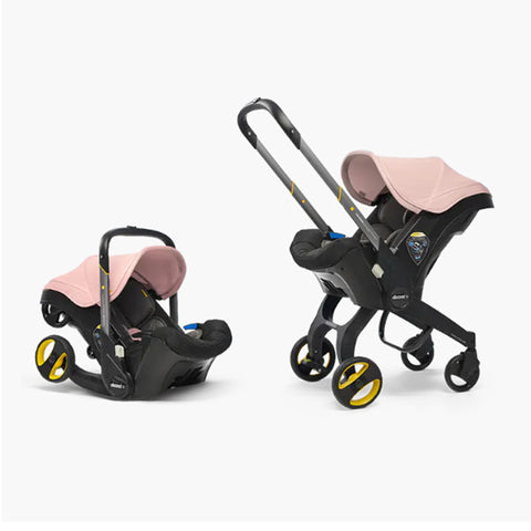 DOONA Autoasiento a Carriola + Base ROSA
