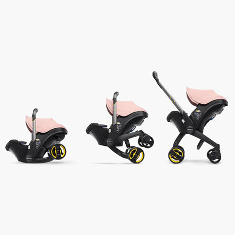 DOONA Autoasiento a Carriola + Base ROSA