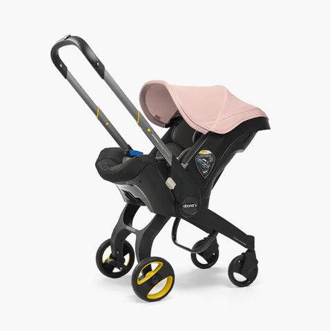 DOONA Autoasiento a Carriola + Base ROSA