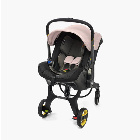 DOONA Autoasiento a Carriola + Base ROSA